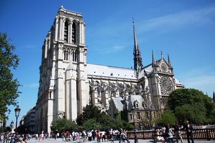 Notre Dame Cathedral in Paris, France — begun in 1163, this Gothic masterpiece took nearly 200 years to build and features flying buttresses, towering spires, and stained glass rose windows that fill the interior with colored light.