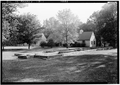 A historic church building with stone foundations set in a pastoral landscape, representing the faith communities that anchored frontier settlements. Churches were often the first permanent buildings pioneers constructed when founding new communities.
